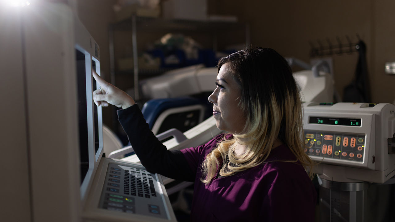 Nurse pointing at computer screen
