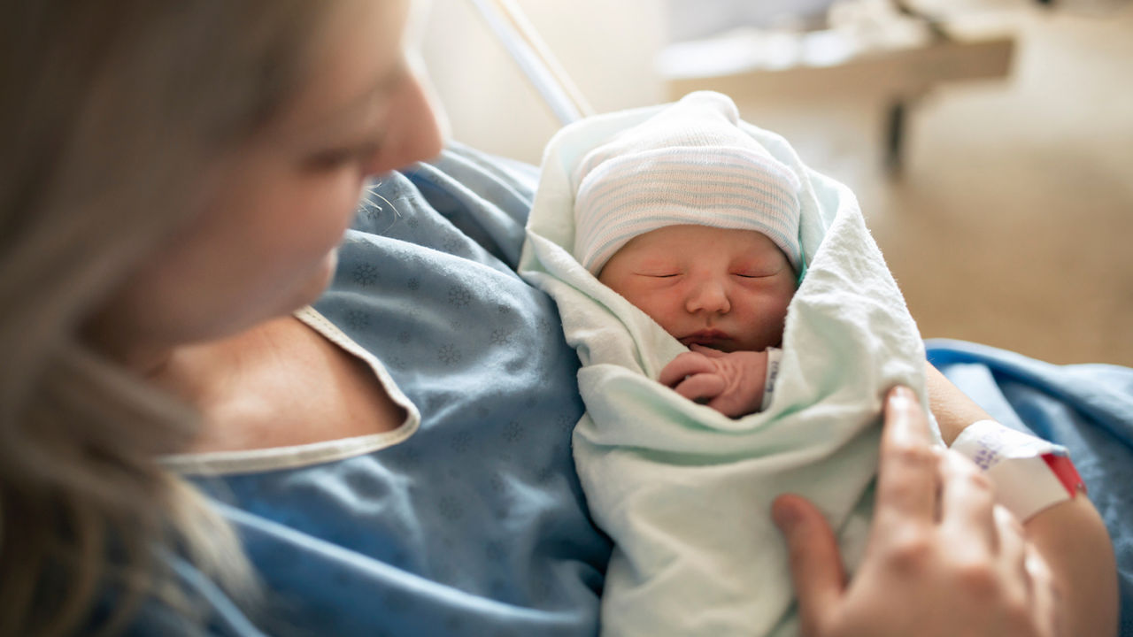 Mom holding newborn baby